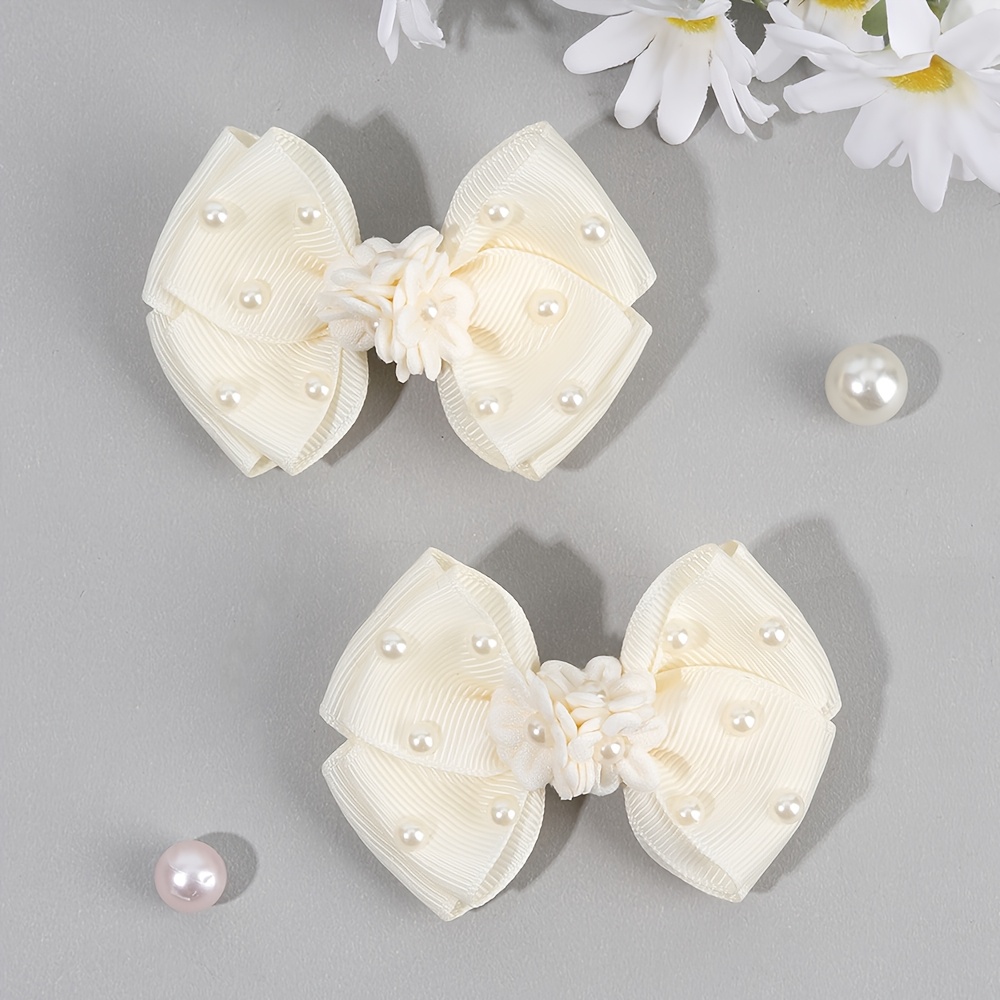 Image of Set Of 2 Hair Clips For Featuring Floral Bows, Faux Pearls, And Solid Color Grosgrain Ribbon, Perfect For Travel And Elegant Hairstyles. A Stylish Accessory Collection For Teens And Adults
