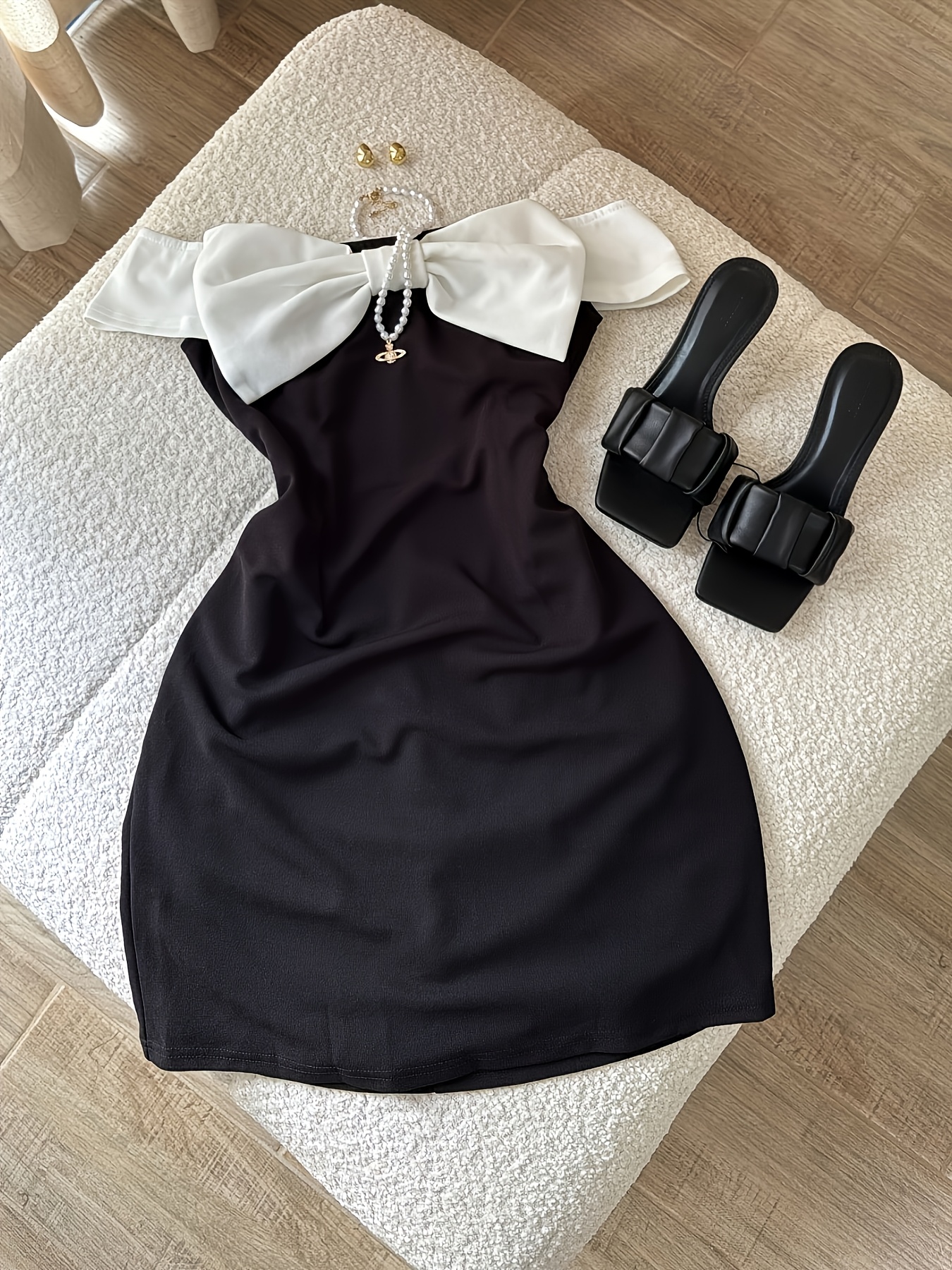 black dress with white bow The Clodagh