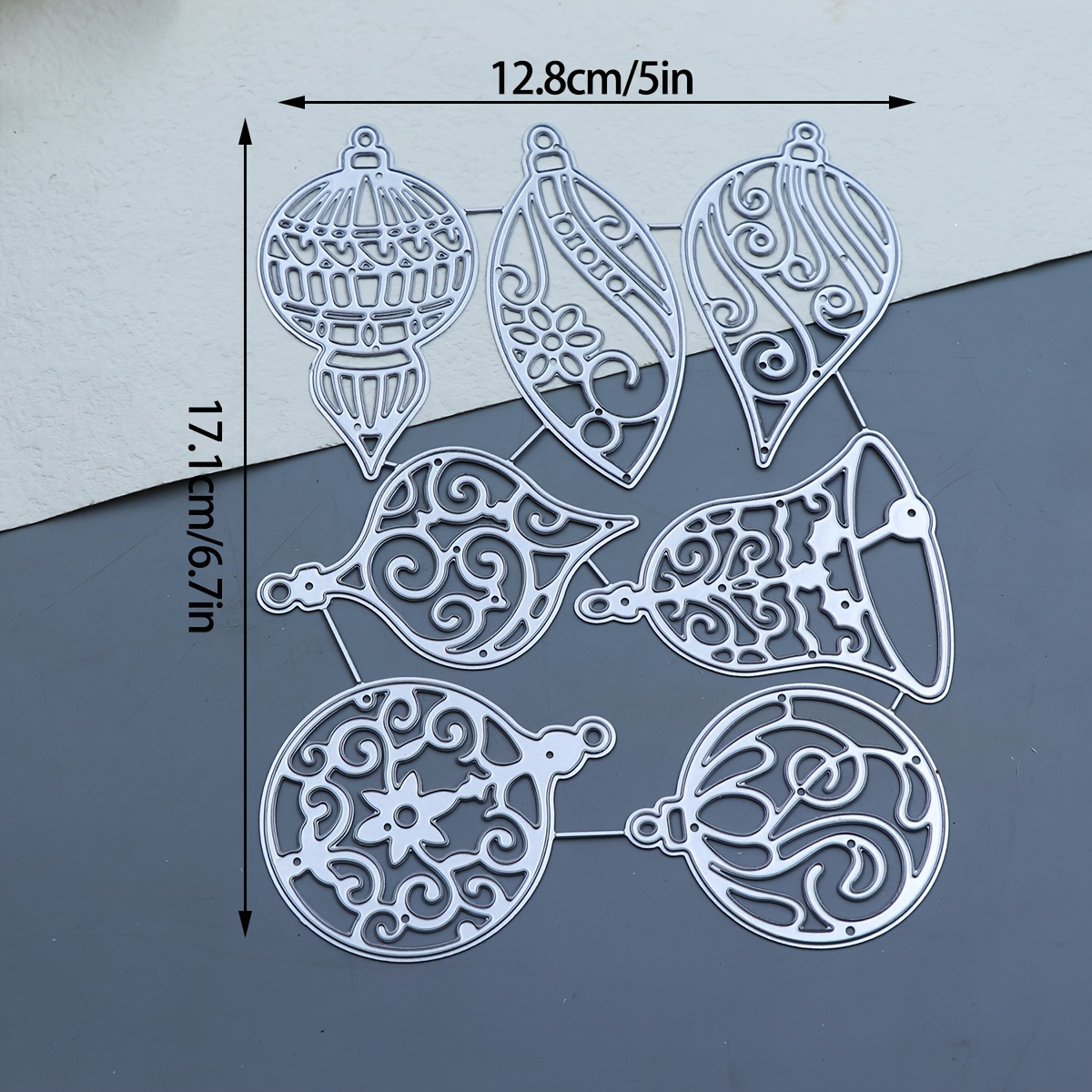 A Metal Cutting And Embossing Die For A Christmas-themed Bell Tag