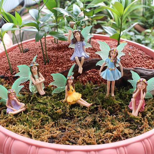 et sæt med 6 blomsterfeer i forskellige stillinger med glødende , der en del af scenerne du har for, uanset om de sidder, står har krydsklædte ben. velegnet til alle slags e arrangementer, bonsai-dekorationer, vaser og sceneropsætninger.