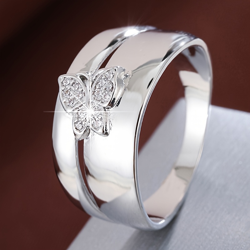 A Design Ring For Women, Set With Synthetic Zirconia, Featuring A Wide Band