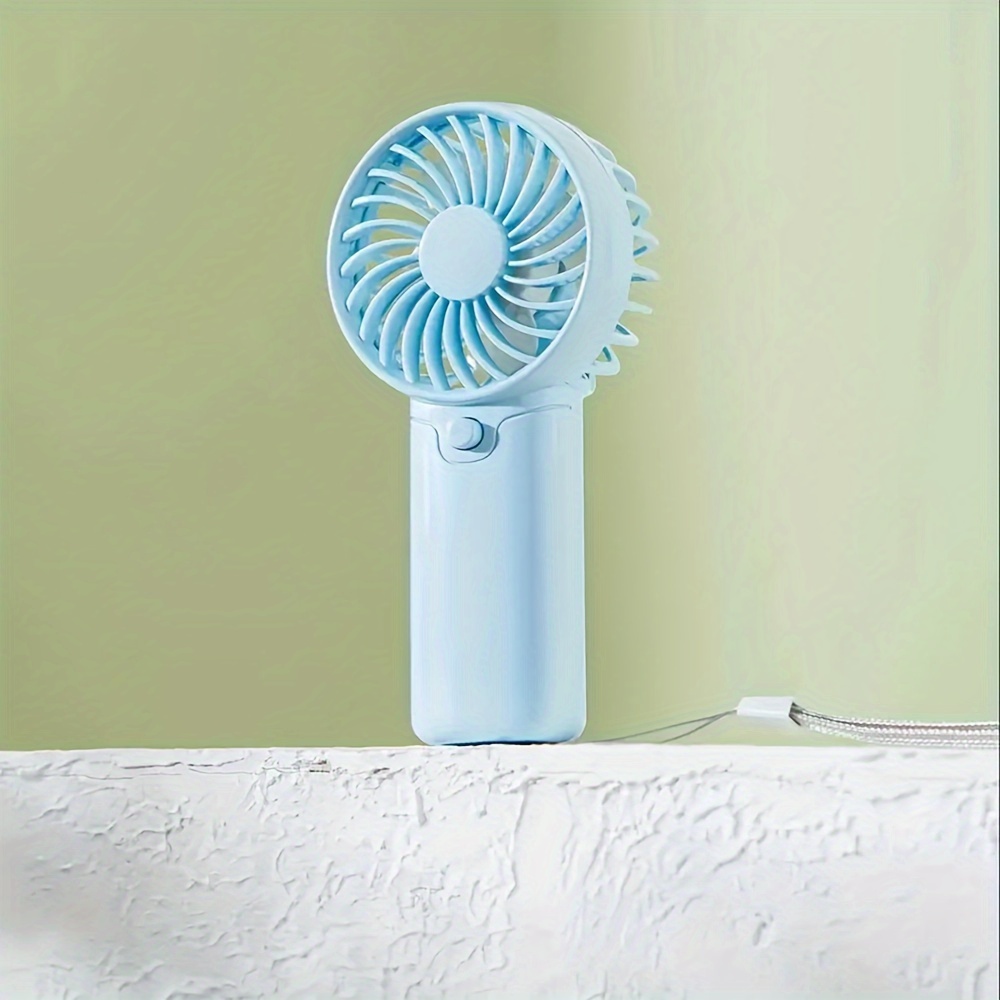 battery operated mini portable fan lightweight handheld fan ideal for office outdoor traveling and camping stay cool   anywhere requires aaa batteries not included