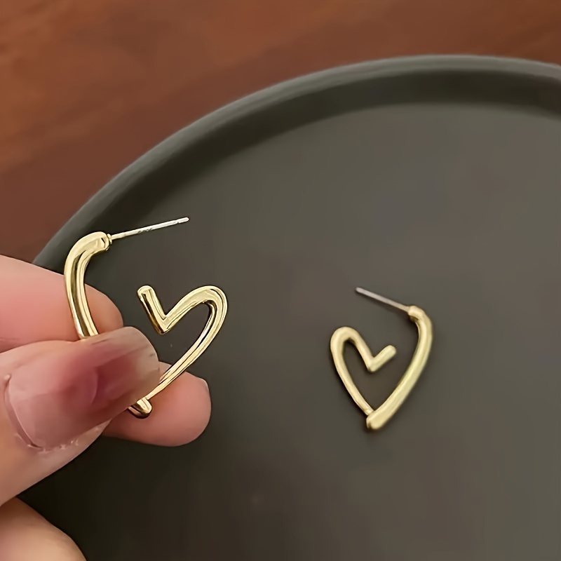 1 pair elegant 18k golden plated hollow heart shaped hoop earrings for women cute 304 stainless steel hypoallergenic non fading versatile for daily wear christmas gift Product details 2
