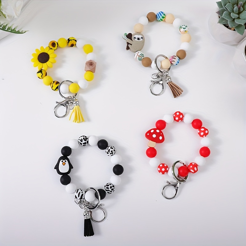 

2~4pcs/set Sweet And Cute Cartoon Charm Silicone Bead Bracelet Charm Keychain Short Tassel Keychain Accessories Bag Pendant Accessories Gift