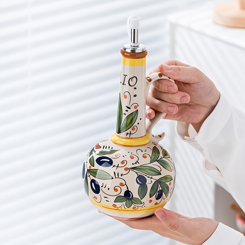   exhibition features hand painted green ceramic olive oil bottles suitable for home kitchens including soy sauce and vinegar dispensers that are leak proof 0