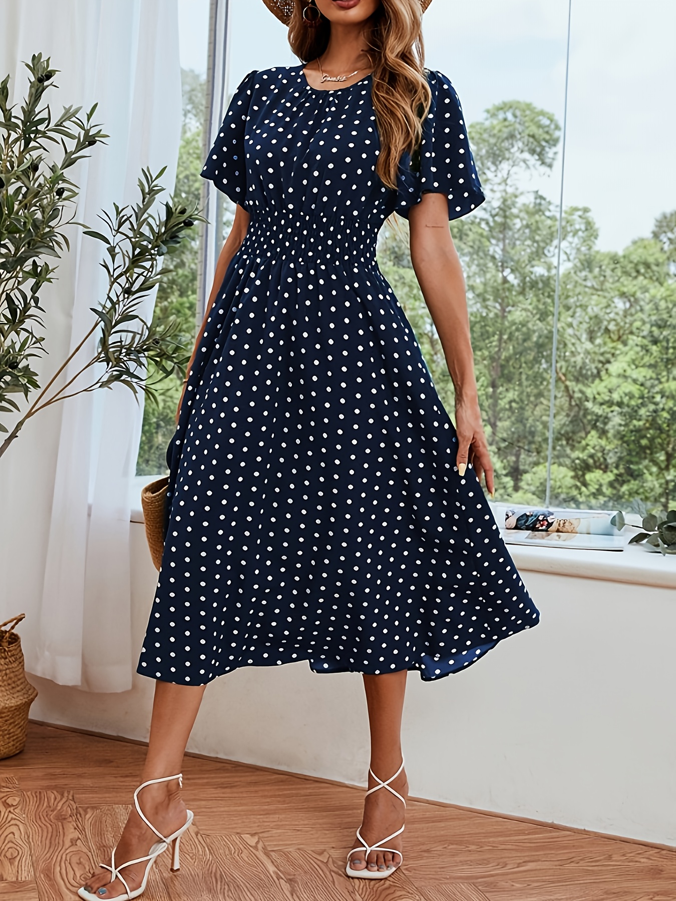 vrouwen elegante marineblauw witte stippenjurk met pofmouwen