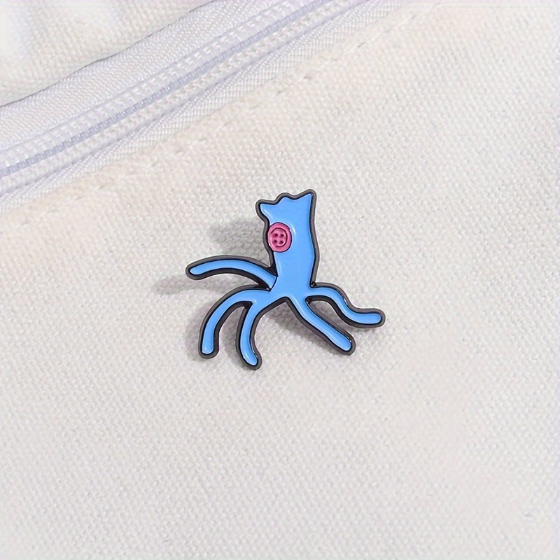 

Qihoo Blue Multi-legged Monster Enamel Lapel Pin – Unique For Backpacks, Coats, And Caps | Cartoonish Design With & Sharp Teeth | Perfect Gift , Backpack Accessory | Design | Alloy Lapel Pin