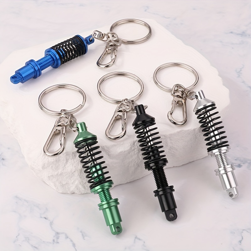 

Modified Black Spring Multicolor Shock Absorber Model Keychain For Men