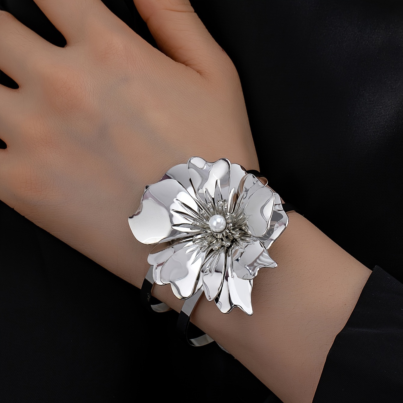 

A Vintage And Exaggerated Lady's Bracelet With Flowers And Pearls Embedded.