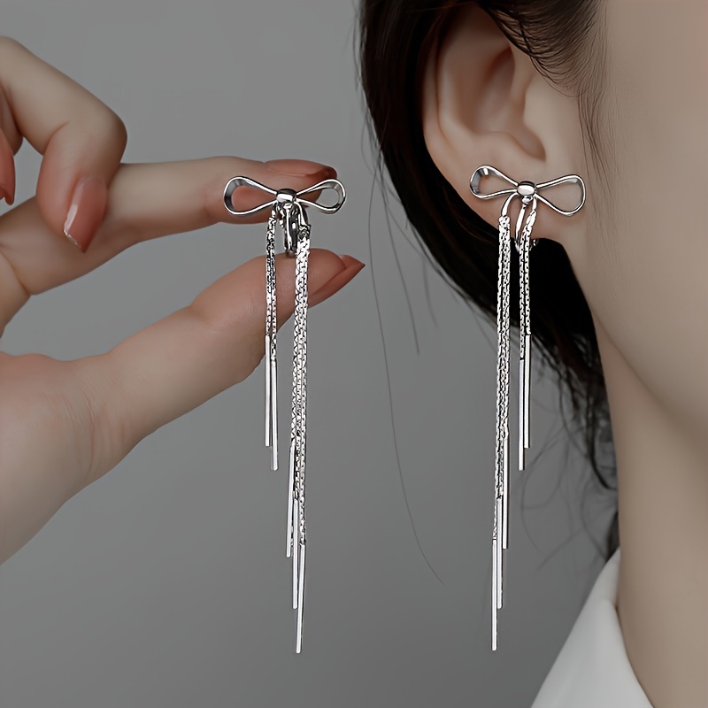 

2pcs Copper Cold Wind Three-dimensional Bow Tassel Ladies Ear Clip Japanese And Korean Style Simple Temperament Long Commuter Earrings Earrings, Spiral Ear Clips/mosquito Coil Ear Clips Random Hair