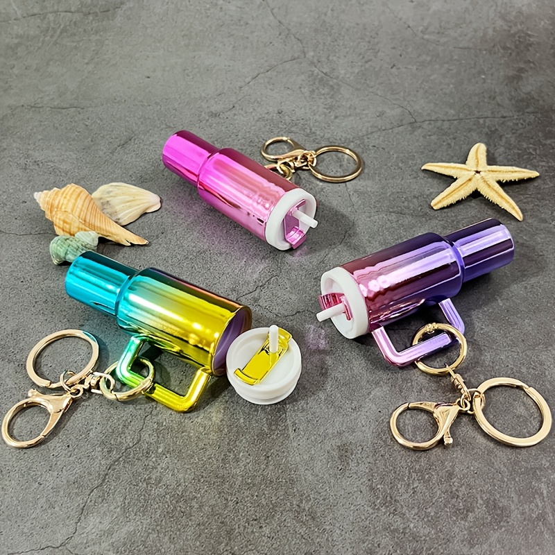 

1pc/6pcs Creative Gradient Mini Water Cup Keychain, Stylish Keychain Accessory, Perfect Commemorative Gift.