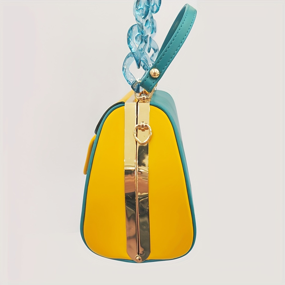 Stylish Two-Tone Round Handbag Made of Durable, Featuring a Detachable Acrylic Chain And Snap Closure. This Versatile Handbag Is Perfect for Both Parties And Everyday Use.