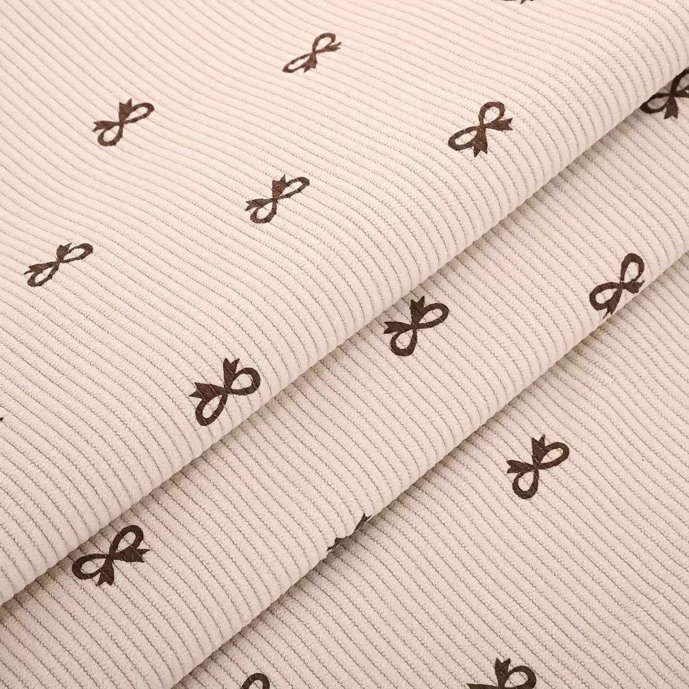 A 19.69inch*62.99inch Four-color Bow Pattern Printed Stretch Corduroy Fabric For Autumn/winter Coats, Skirts, Pants, And Children's Clothing