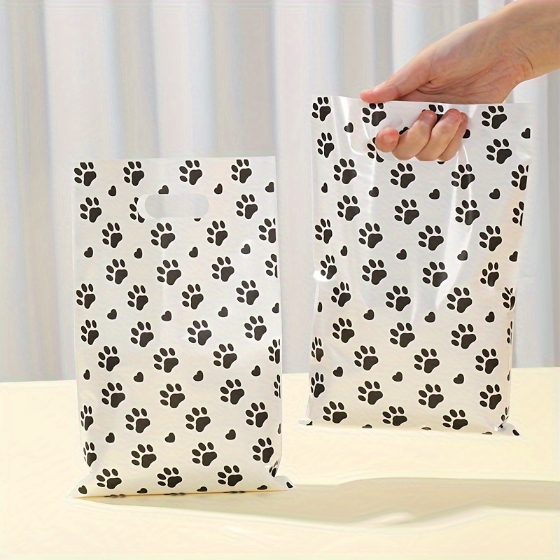 

10/25/50pcs, Dog Claw Black White Gift Bag, 16.5*25cm, Animal Theme Party Decoration Plastic Handbag, Birthday Party, Shower Party Decoration Candy Bags, Table Decoration