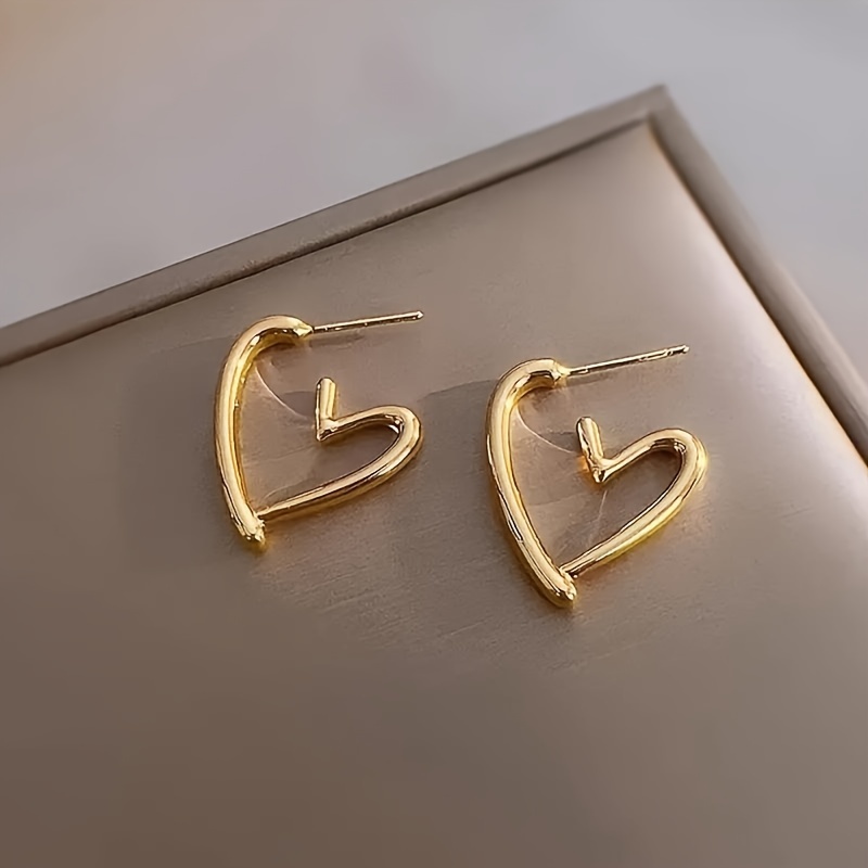 1 pair elegant 18k golden plated hollow heart shaped hoop earrings for women cute 304 stainless steel hypoallergenic non fading versatile for daily wear christmas gift Product details 3