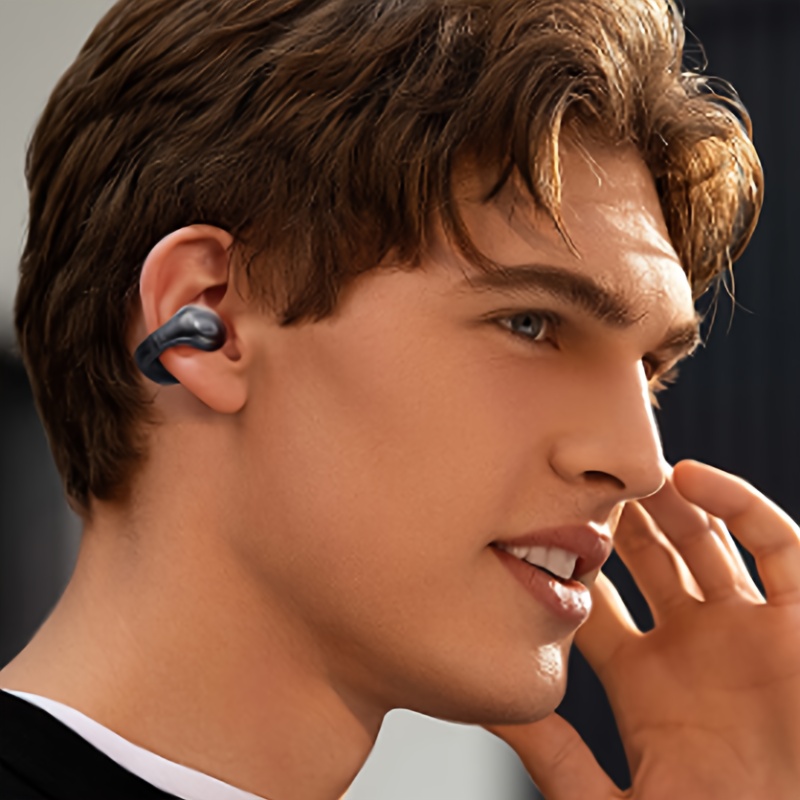 De draadloze oorclip hoofdtelefoon