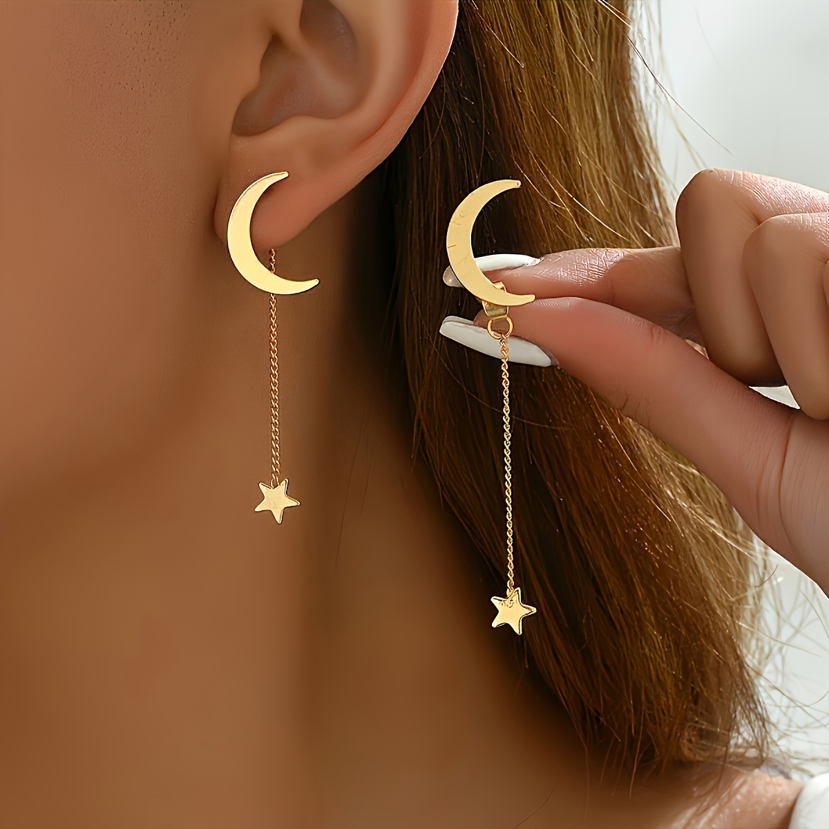 

A Pair Of Delicate And With Tassels, Stars, And Moons That Can Be Detached