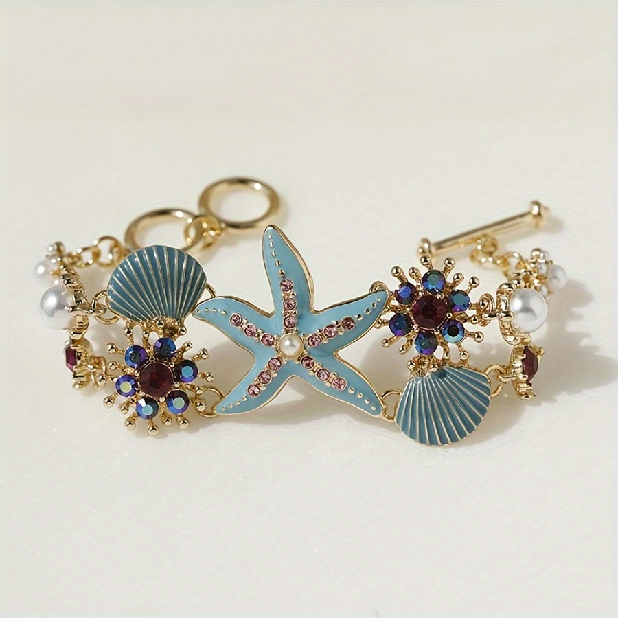 One gorgeous starfish pendant bracelet with shell details and sea coral beads suitable for beach daily wear and ocean vacation style