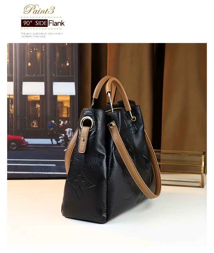 Black handbag showing hardware and strap detail