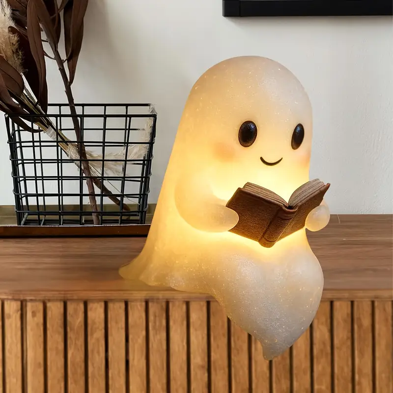 cute glowing reading book lamp - plug-free battery-powered warm light with cozy book light effect, 8.6 adorable plush-like figurine with eyes & glowing pages - indoor/outdoor halloween & decor, night light for bedroom, shelf, mantel - ideal gift for book lovers & spooky home decor Product details 1