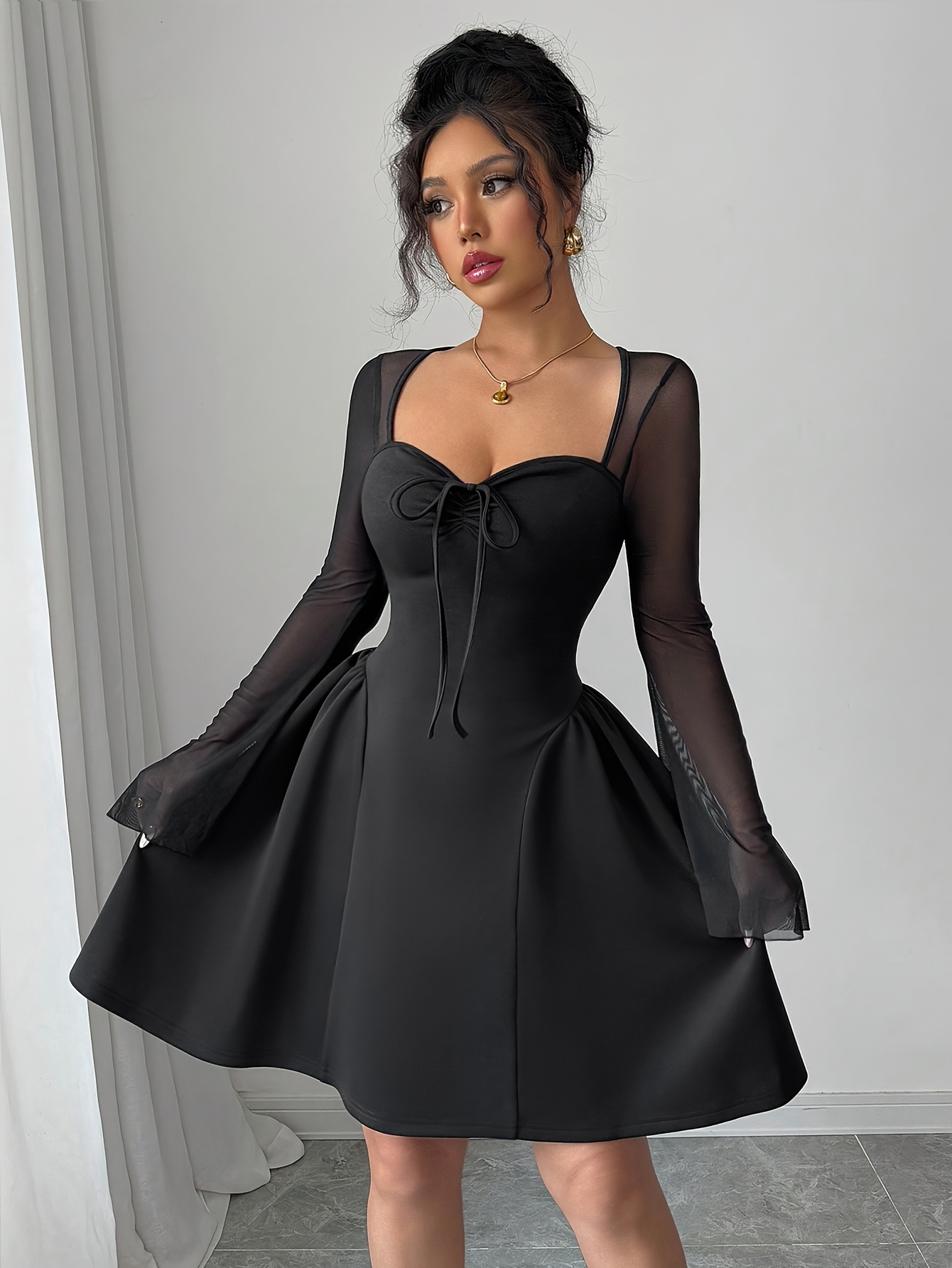 black dress with sheer sleeves sold on Temu United States