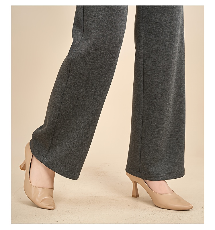 Image focusing on the straight-leg cut and material of the pants