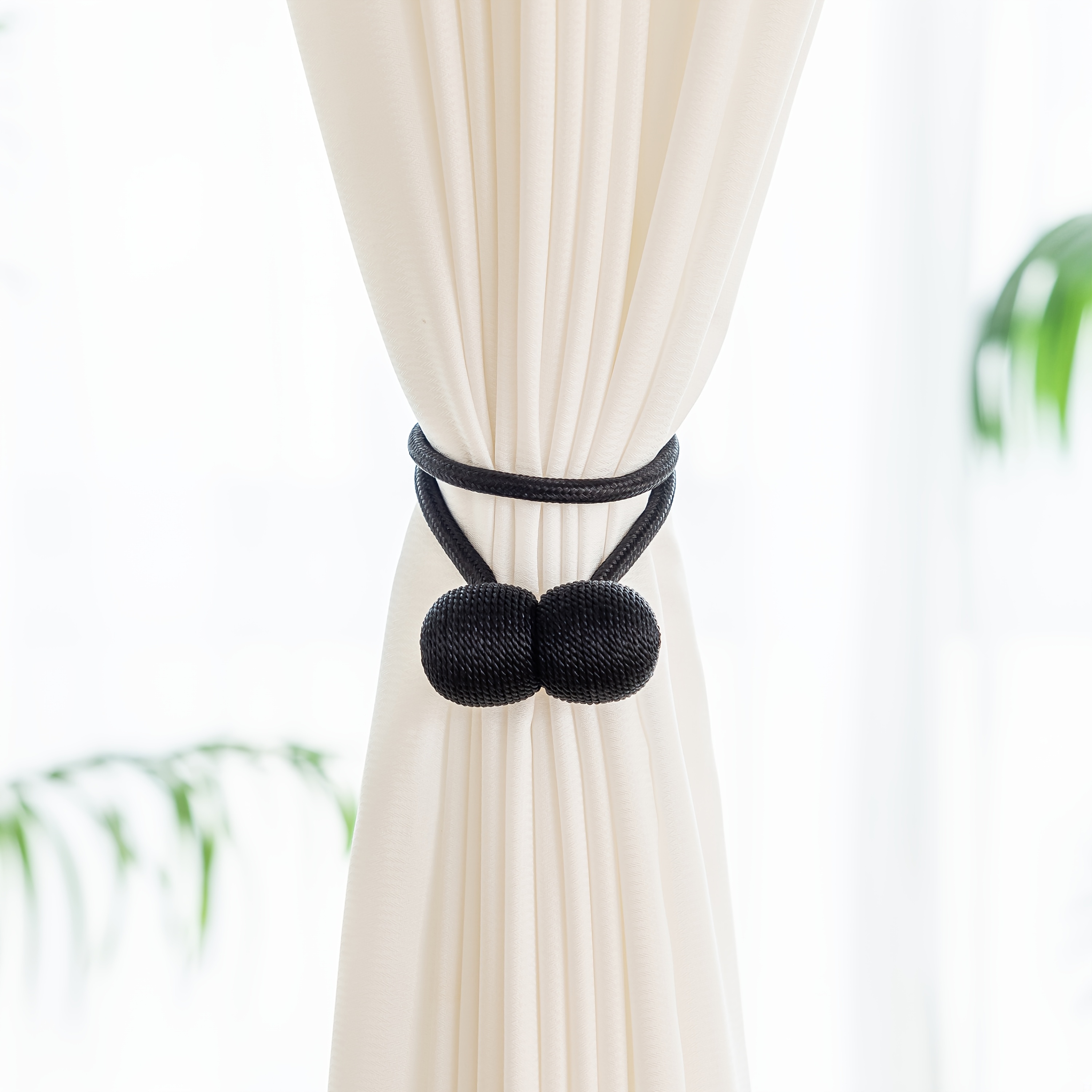 A Set of Two Modern Minimalist Magnetic Curtain Ties Is on, Featuring Thicker Twisted Ropes And Flexible Magnetic Ties. They Are Durable, Easy to Install, And Do Not Require Drilling, Making Them Perfect for Bedroom And Living Room Decor
