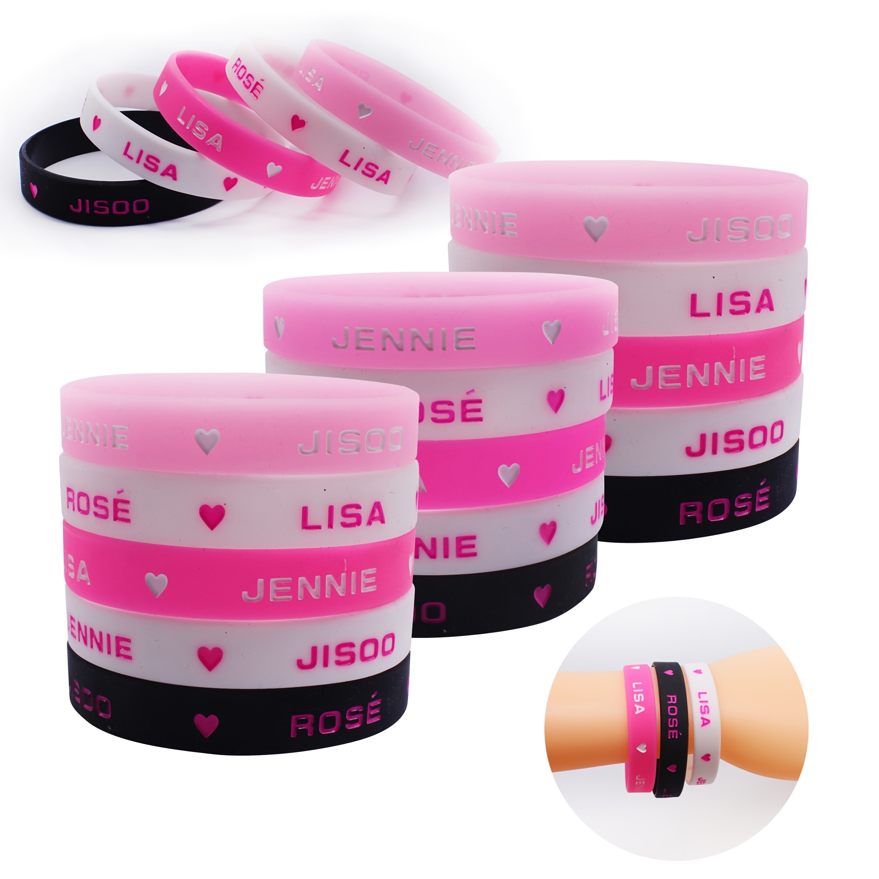 

5pcs Of Pink-themed Silicone Wristbands Featuring Heart Designs, With 2 Of Having Fluorescent Colors.