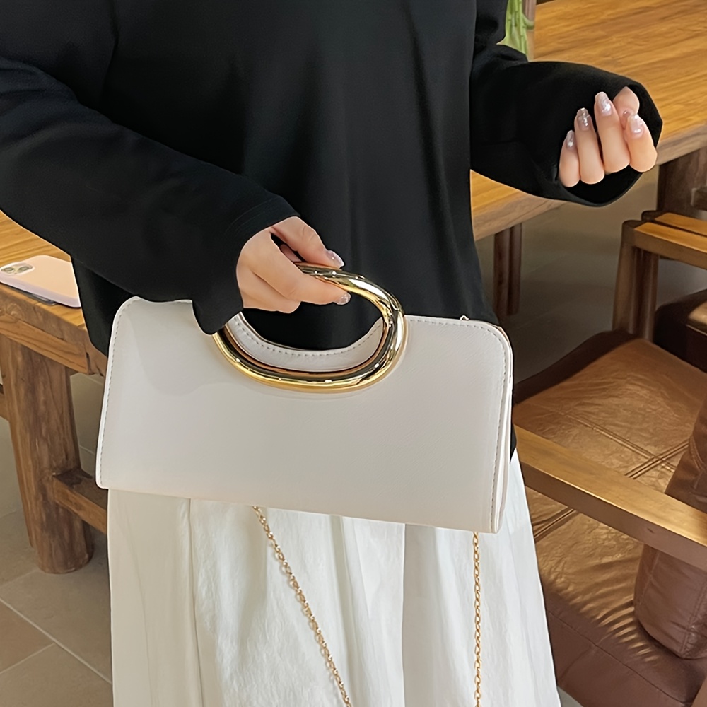 Elegant Metallic Handbag with Oval Metal Handle and Chain Strap