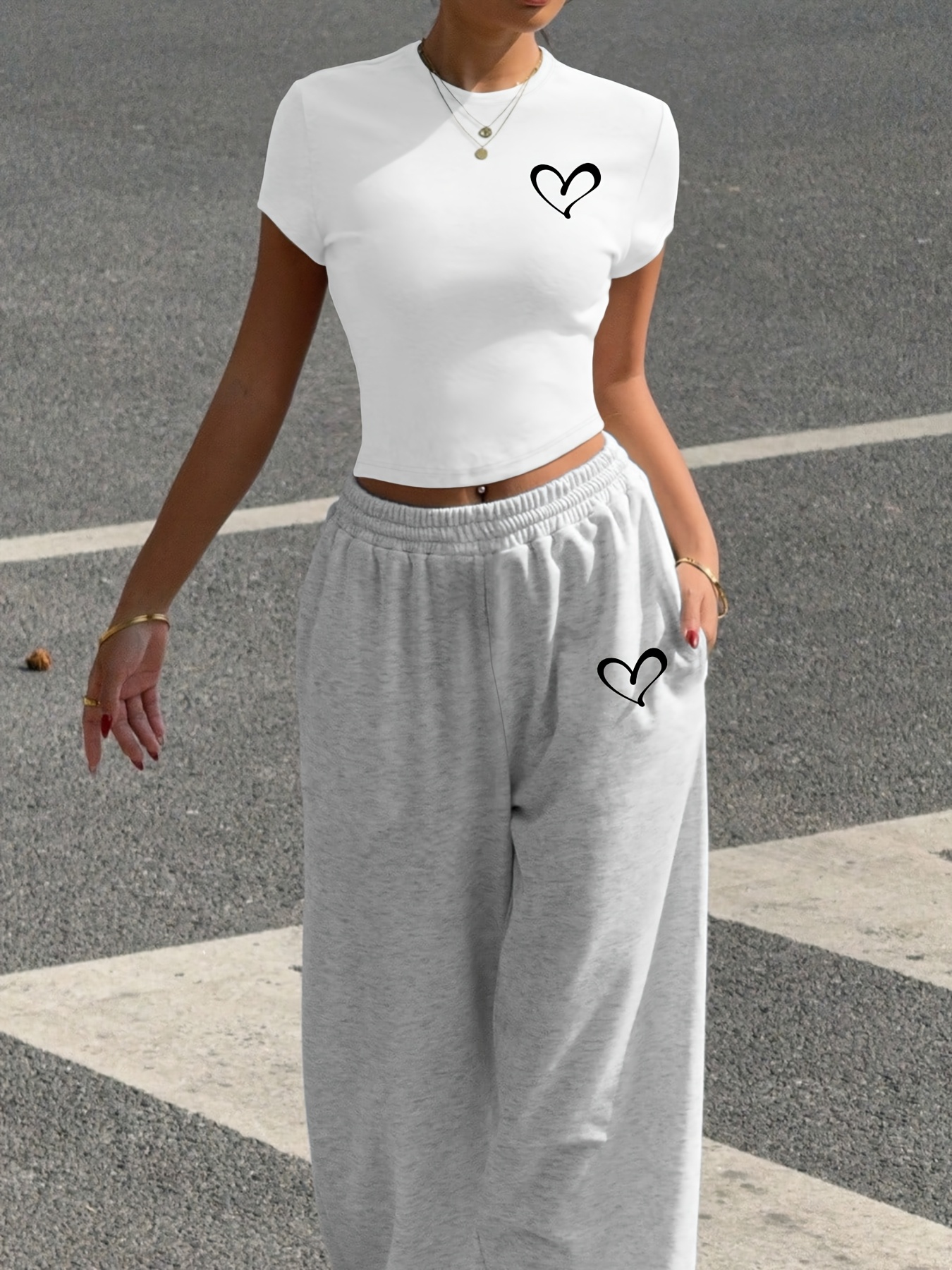 A Stylish Two-Piece Set for All Seasons, Featuring a Heart Print Casual Outfit, Consisting of a Fitted White Short T-Shirt And Tapered Jogger Pants, Machine Washable, Perfect for Street Fashion And Vibes