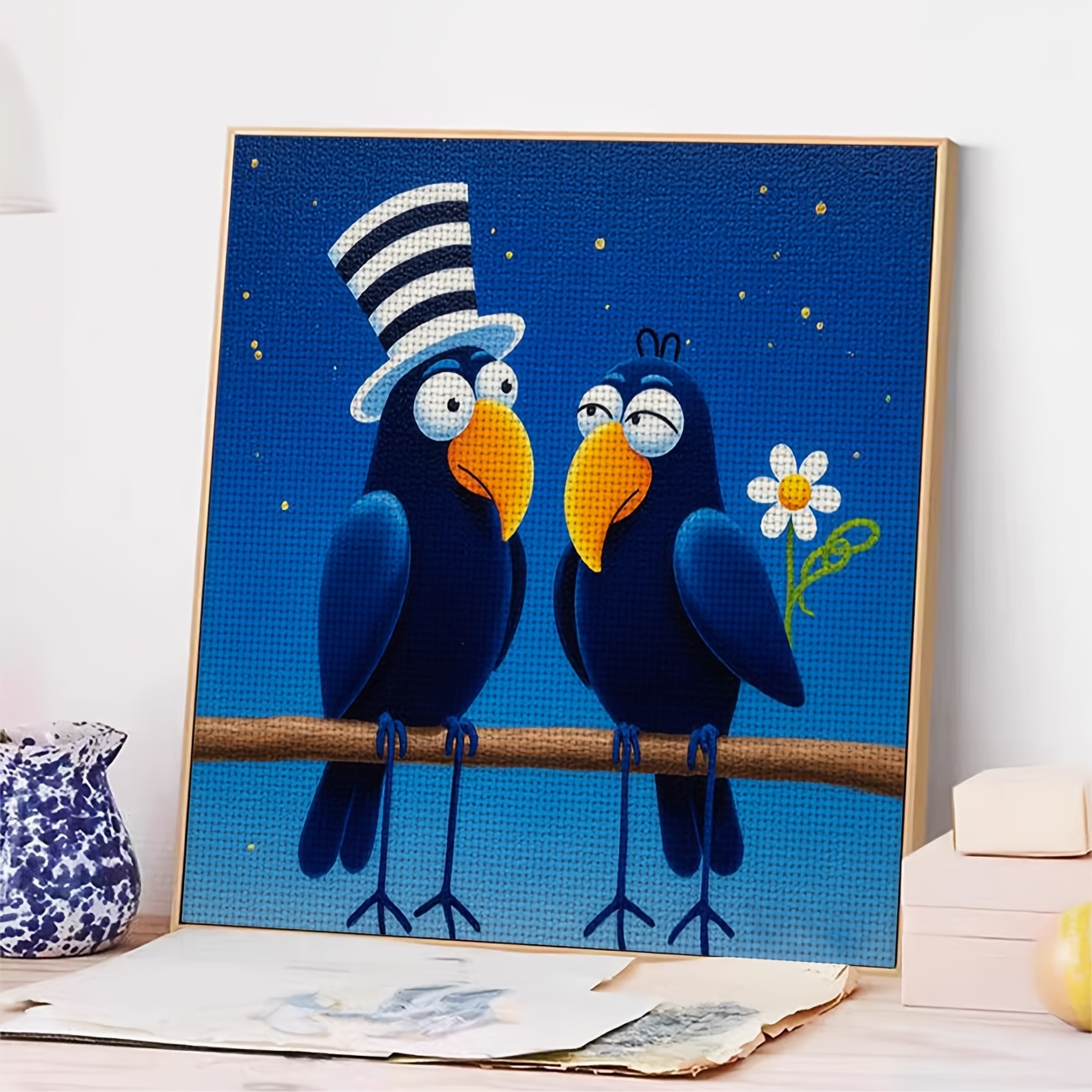 Cross-Stitch Kit Featuring Two Blue Birds Wearing Hats on a Branch