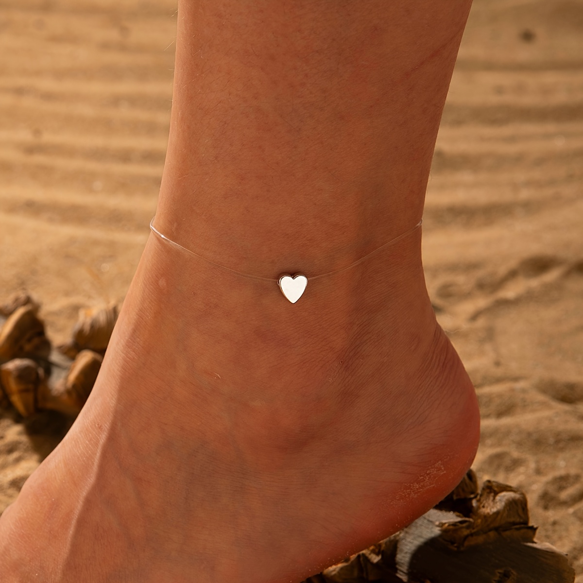 an elegant and minimalist acrylic heart pendant anklet   single layer transparent fishing line material   suitable for daily wear and party occasions and can   serve as a holiday gift for friends its     adds