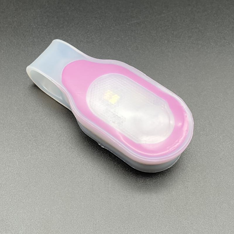 Magnetic Clip Light With Soft Silicone, Suitable For Hiking, Running, And Work. Features Soft Silicone, Ideal For Hiking, Dog Walking, And Camping. Includes Button Cell Battery