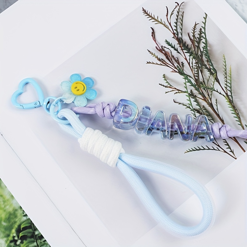 TEMU A Cute Floral Letter Knot Custom Keychain, Of A Lanyard, Letter Beads, And Transparent Flowers. In Multiple Colors. Custom Letters, Custom
