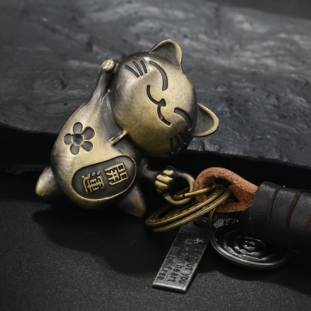 Image of Creative Keychain For Men And Women, A Small Gift Made Of Alloy With A Vintage Bronze And Woven Leather Pendant