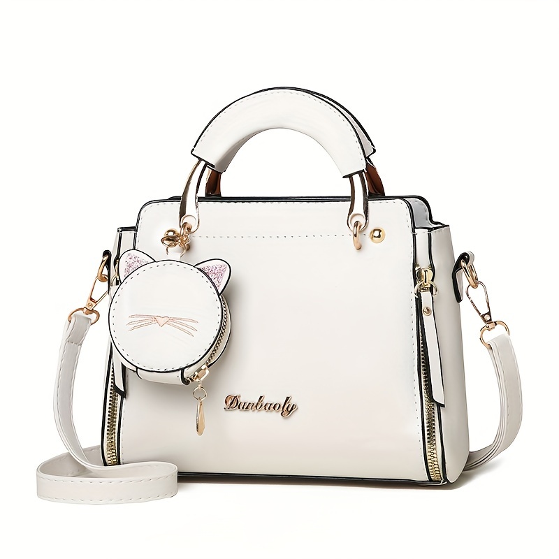 

White Pu Handbag With Kitty Charm And Adjustable Shoulder Strap