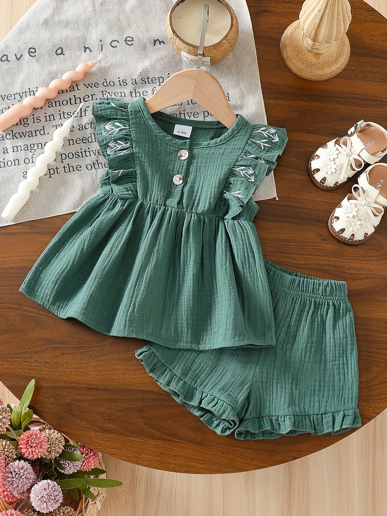 girls summer outfit set for infants featuring an embroidered flutter sleeve top and shorts this floral clothing series with front buttons is designed for easy dressing of newborns the t shirt has an elastic waist and the cute shorts are perfect