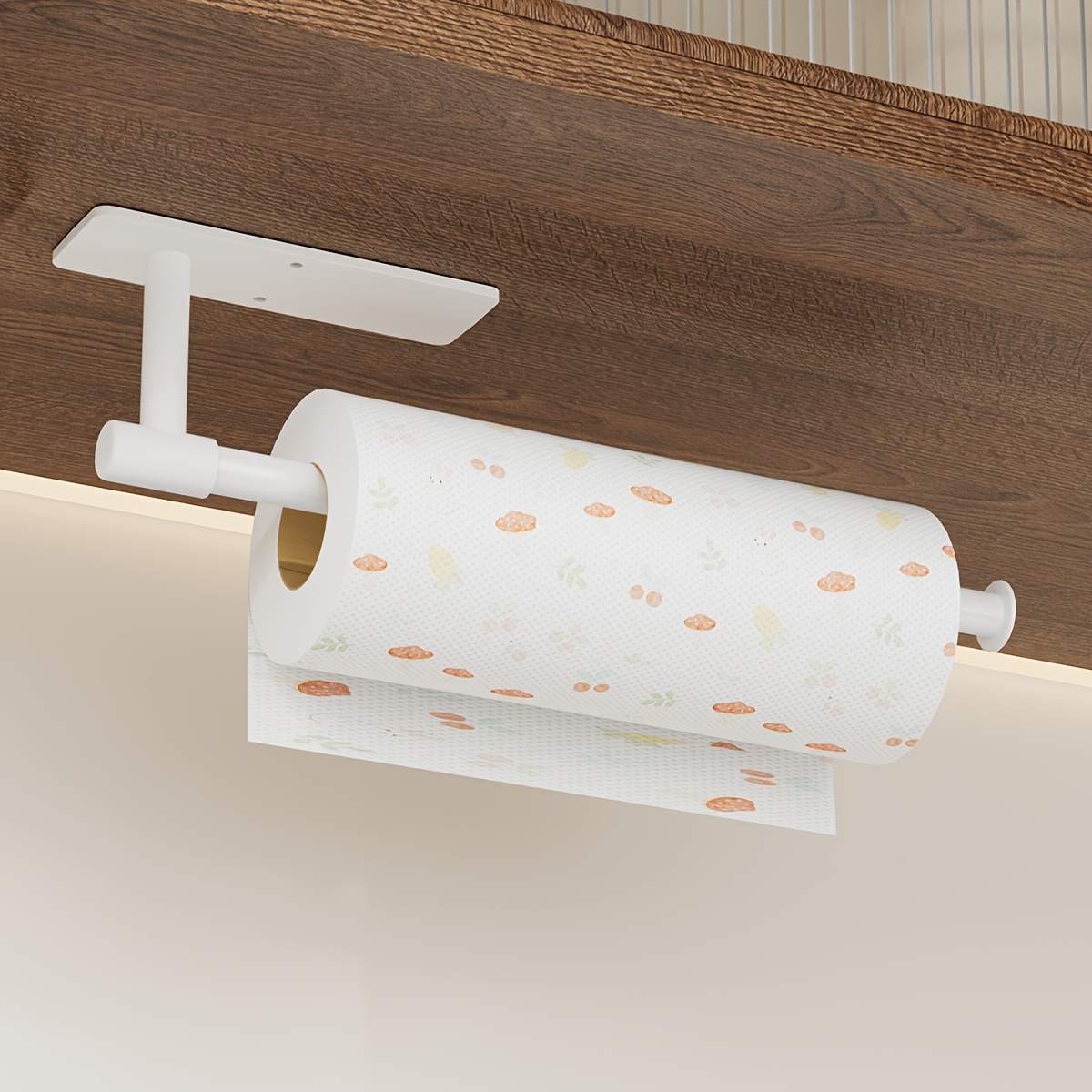Image of A Self-adhesive Paper Towel Holder Made Of Plastic And Carbon Steel, Designed For Under Cabinets In Kitchens And Rv Bathrooms, Featuring Storage For Plastic Wrap And Rolls