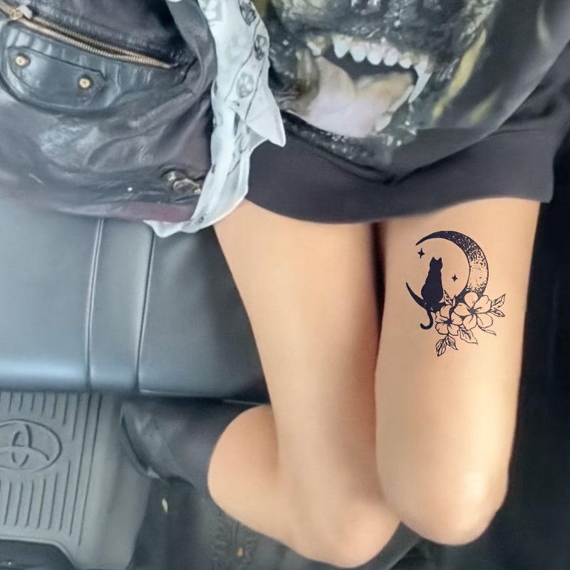 a black cat crouching   stars and the moon   with   accents this design combines     charm of cats with the   texture of stars   and flowers     to     or thighs and is