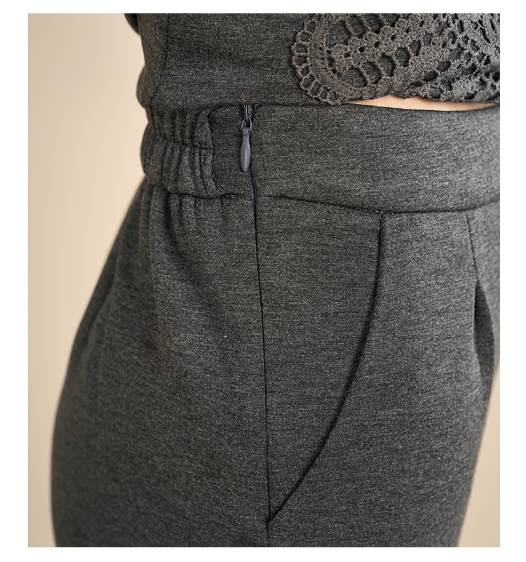 Close-up detail of the side zipper on the women's jacket