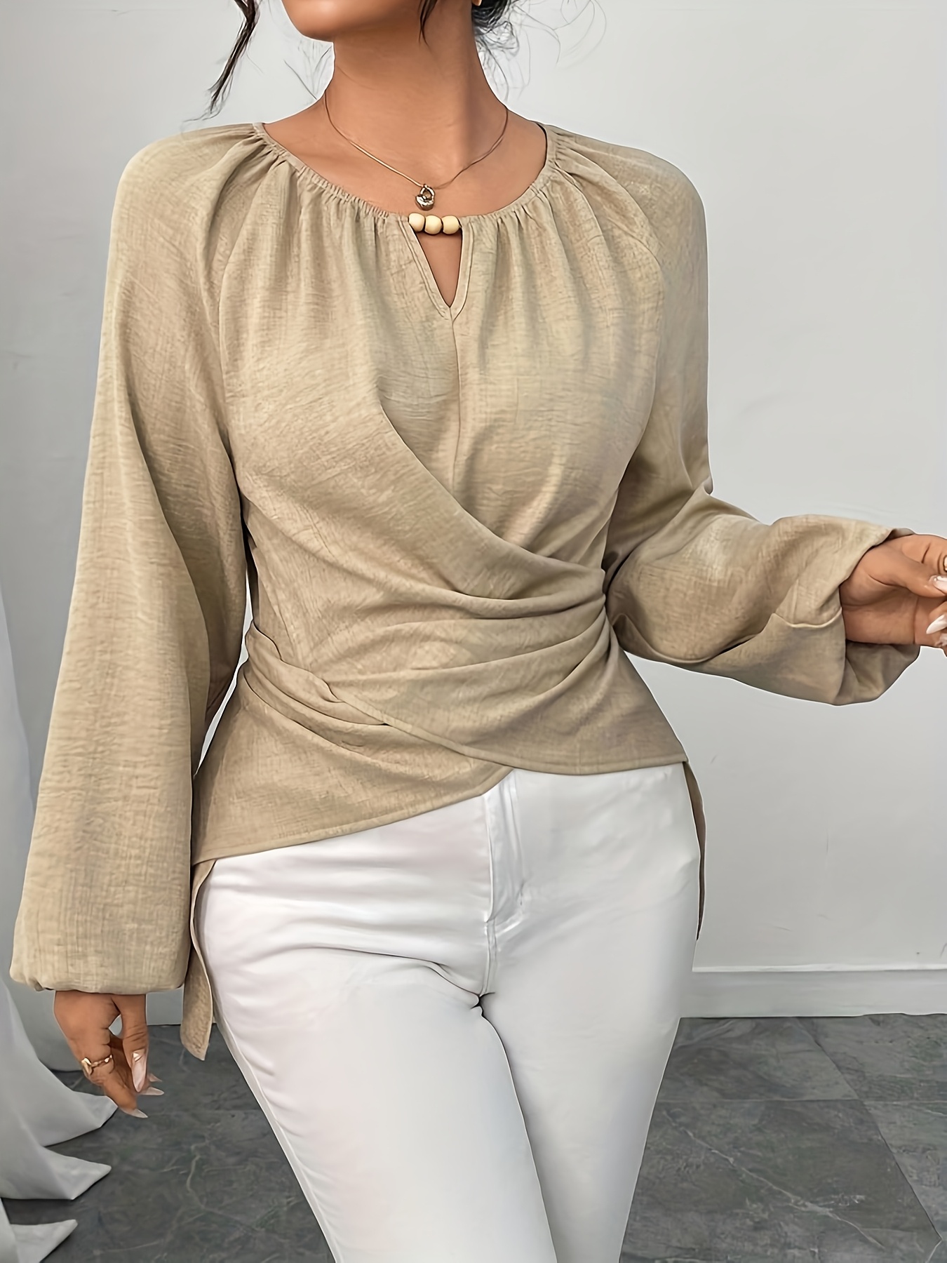 An Elegant Long-Sleeve Shirt for Women, Featuring a Beaded Wrap Design with a Solid Color And Faux V-Neck Decoration, Designed for Autumn And Winter with a Shorter Front And Longer Back
