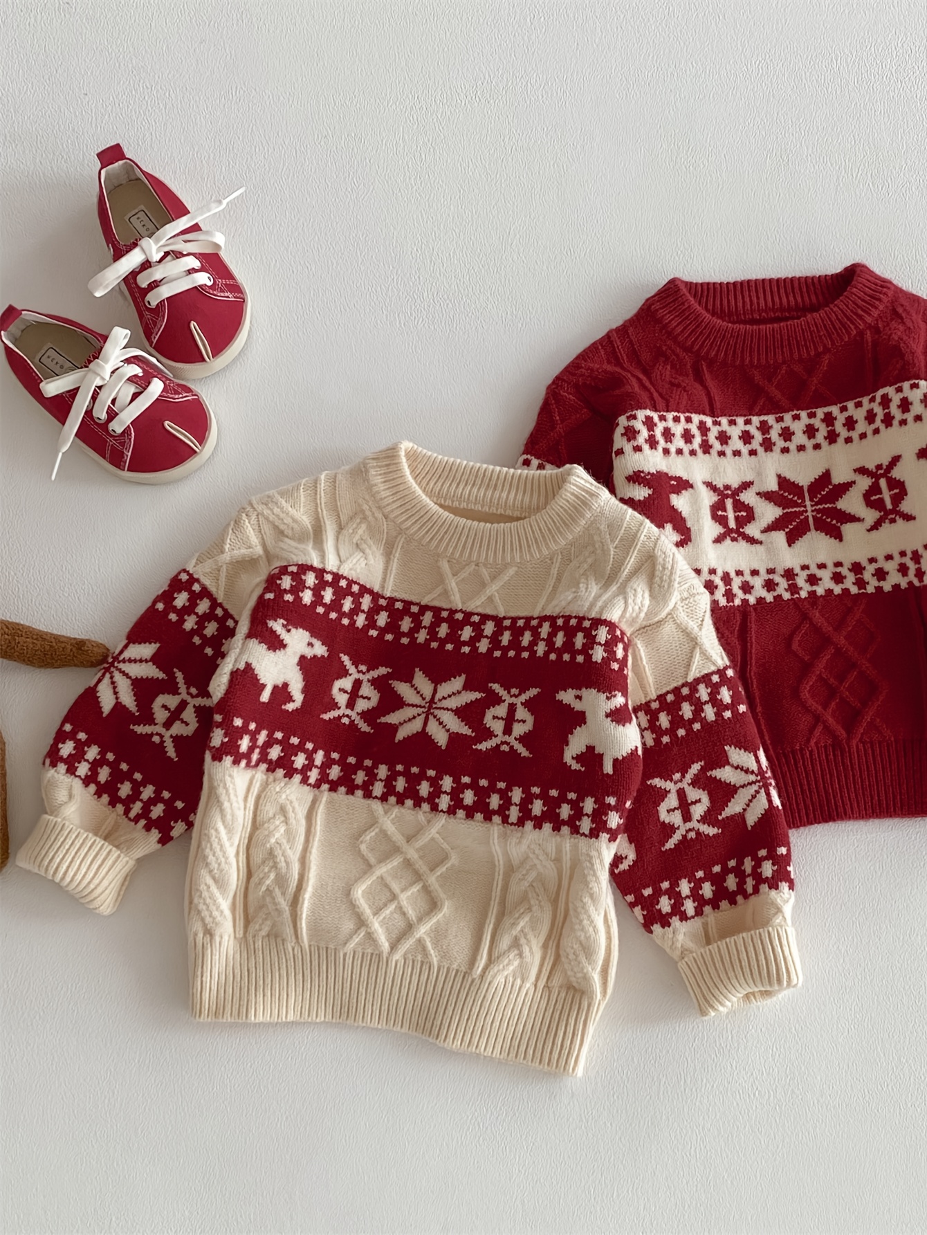 Cream and red cable-knit sweater with reindeer band