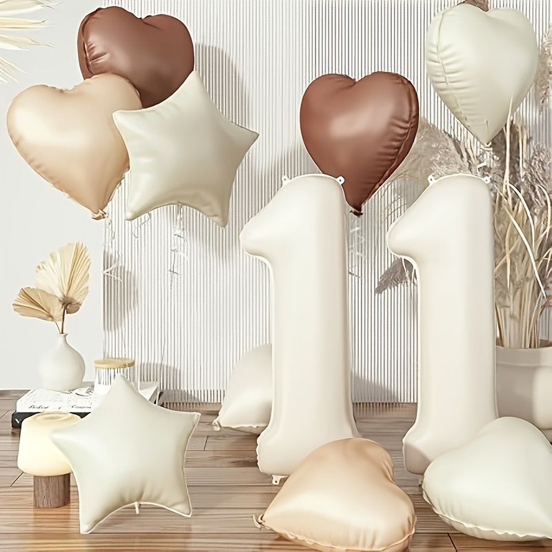 Image of Set Of 11 Balloons In Sand White, Featuring Cream, Brown, Apricot, And Beige, Each Measuring 32 Inches. Includes Tan Heart Balloons And A Boho-style Helium Nude Neutral Star Balloon With Ribbon