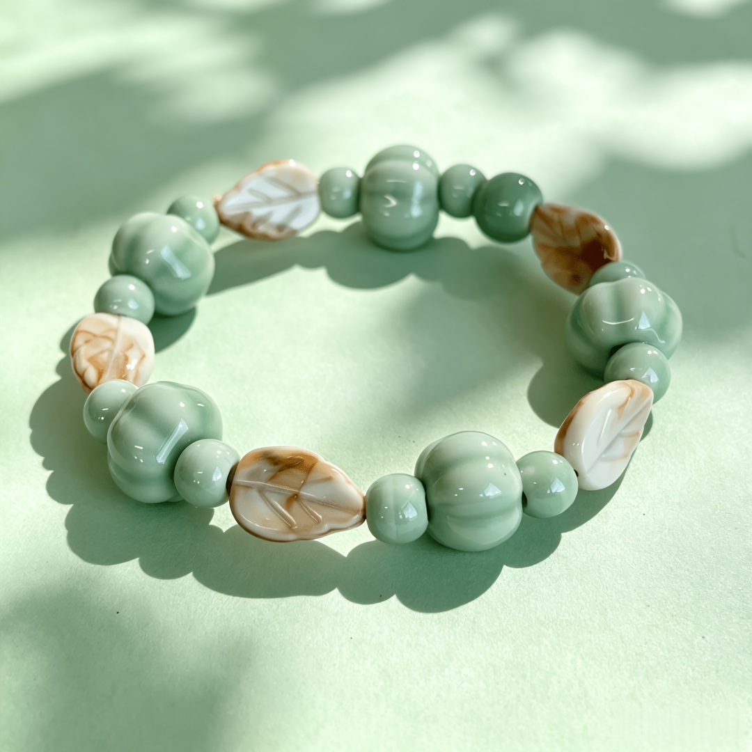 TEMU A -glazed Ceramic Pumpkin-shaped Stretch Bracelet—featuring 5 Gradient Brown-and-white Embossed Leaves And 5 Contrasting Light Turquoise Pumpkin