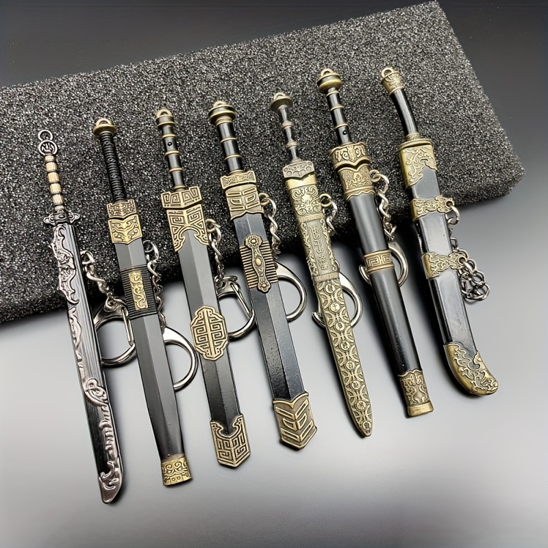 

7-piece Set Vintage Style Miniature Sword Keychains, Zinc Alloy Collectible Weapon Model Key Rings With Scabbards, Ideal For Collectors And Festival Gift Decoration