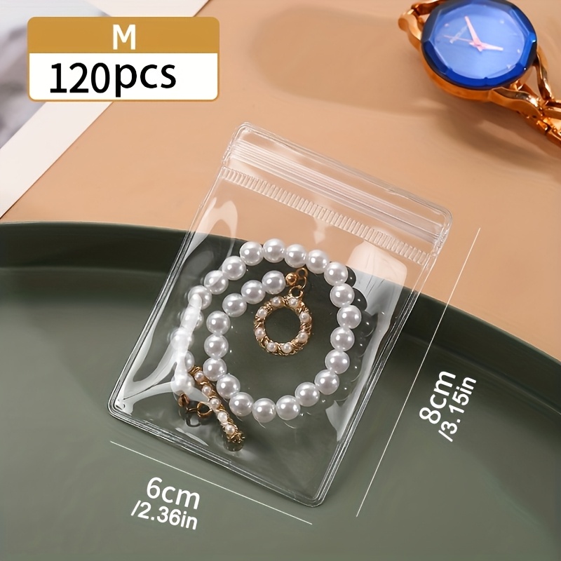TEMU Bolsas de cremallera transparentes autosellables para joyería, 120 piezas, mini bolsitas impermeables y antioxido resellables para anillos,