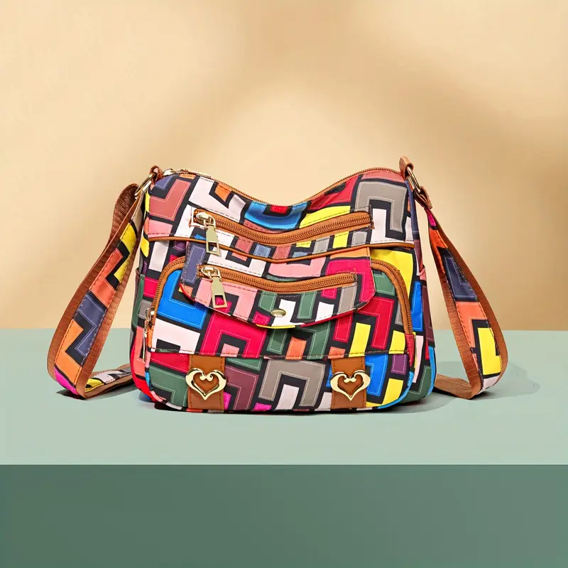colorful geometric hip hop style womens crossbody bag large capacity with multiple pockets durable nylon vibrant red with brown accents zip closure details 0