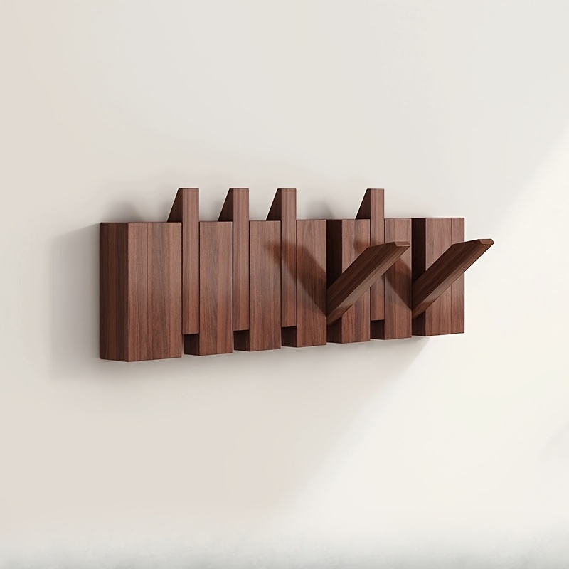Image of A Coat Rack Designed Like Piano Keys, A Wall-mounted Coat Rack That Drilling, An Over-the-door Hook For Coats, A Shelf For The Wall, And A Storage Solution For Coats And Hats In The Bedroom
