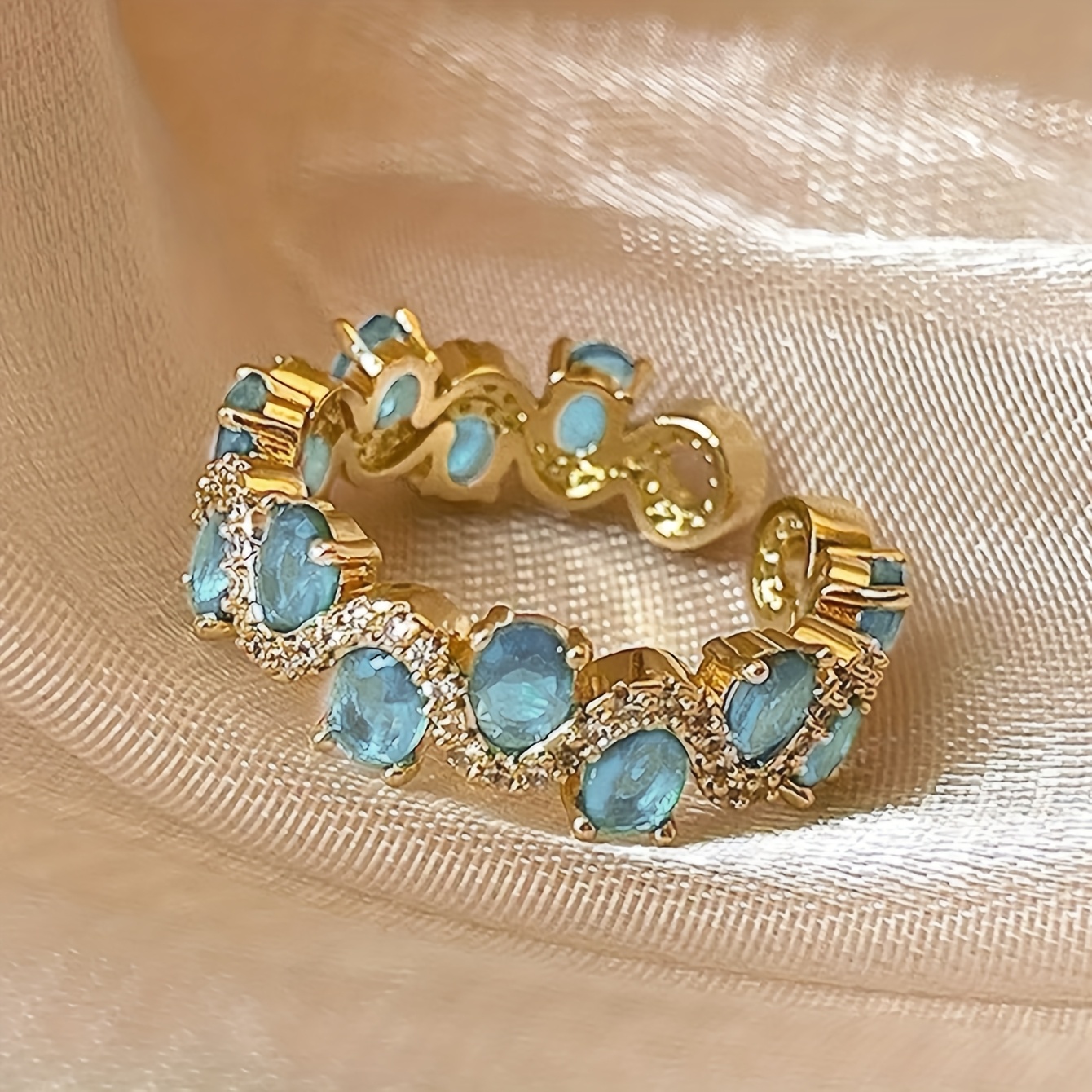 Image of A Unique Piece That Embodies A And Luxurious Vibe, Featuring A Lake Blue Synthetic Zirconia, Perfect For Women Attending Dinner Parties , Showcasing And Elegant In A Single Ring
