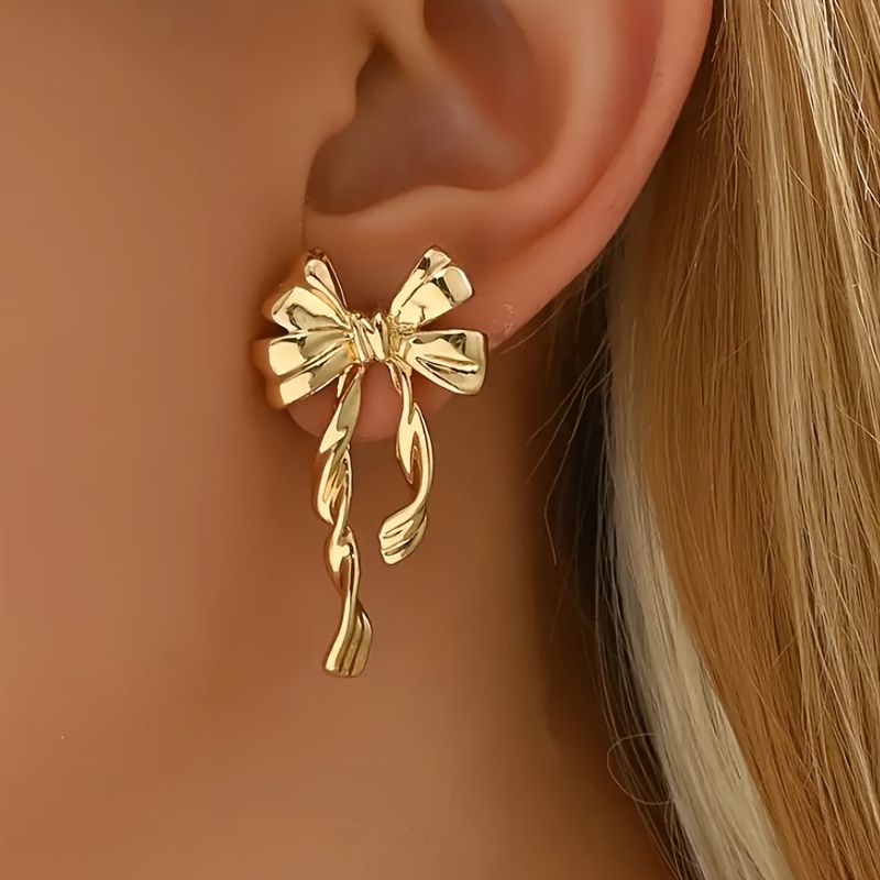Image of A Pair Of Long Spiral Bow Earrings In Bohemian Style, Exuding , Perfect For Women' Commutes And Vacation , A Creative Gift
